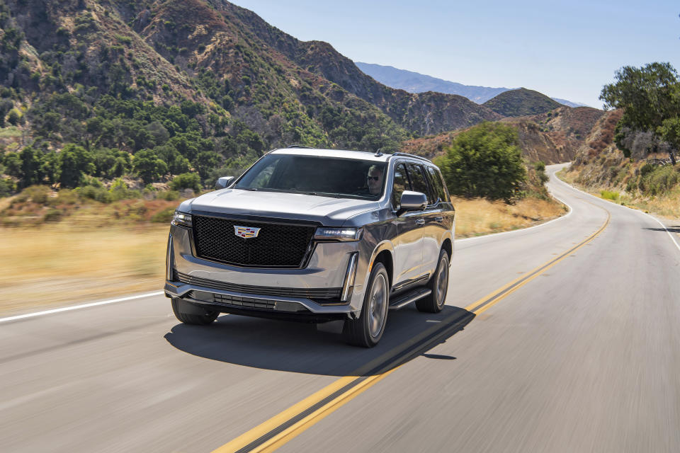 This photo provided by General Motors shows the 2021 Cadillac Escalade, a three-row luxury SUV with a standard V8 engine and enormous digital display screens. (Courtesy of General Motors via AP)