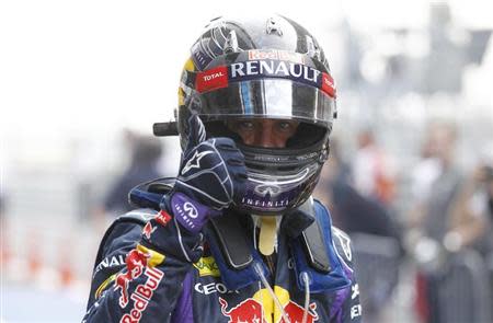 Red Bull Formula One driver Sebastian Vettel of Germany reacts after the qualifying session of the Indian F1 Grand Prix at the Buddh International Circuit in Greater Noida, on the outskirts of New Delhi, October 26, 2013. REUTERS/Adnan Abidi