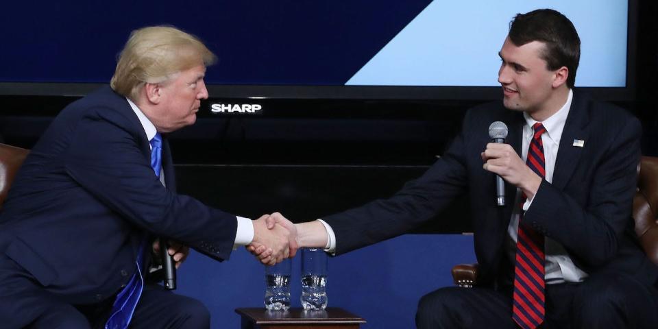 President Donald Trump shakes hands with conservative activist Charlie Kirk at a forum dubbed the Generation Next Summit at the White House on March 22, 2018.