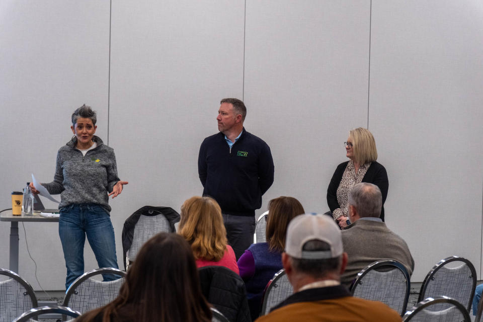 Jennie Winegarner, Canyon ISD board president addresses the audience in December 2023 with fellow board members Casey Posey and Laurie Gilliland at the Happy Bank Conference Center in Canyon.