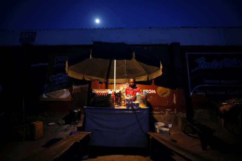 A man awaits customers as he stands at his noodle cafe while authorites continue the 14 days lockdown in a bid to contain the spread of coronavirus disease (COVID 19) in Abuja