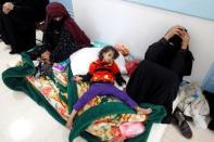 A girl infected with cholera lies on the ground at a hospital in Sanaa, Yemen. REUTERS/Khaled Abdullah