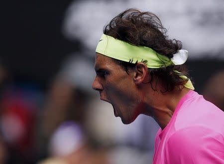 Rafael Nadal of Spain reacts after hitting a shot to Tomas Berdych of the Czech Republic during their men's singles quarter-final match at the Australian Open 2015 tennis tournament in Melbourne January 27, 2015. REUTERS/Athit Perawongmetha