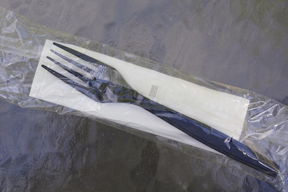 A plastic fork is seen in Sacramento, Calif., Friday, June 17, 2022. A California proposal would reduce the amount of plastics used for single-use products like eating utensils, food containers , dish soap and shampoo bottles. State Sen. Ben Allen, D-Santa Monica, made the bill public on Thursday, June 16, 2022. (AP Photo/Rich Pedroncelli)