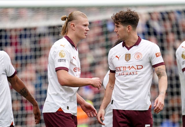 Erling Haaland, left, celebrates after scoring City's third goal 