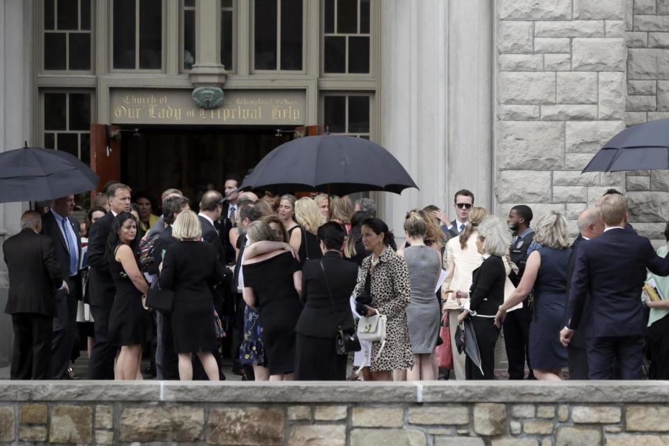 Mourners for Kate Spade gather outside Our Lady of Perpetual Help Catholic Church in Kansas (AP)