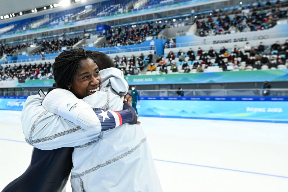 erin jackson and her coach celebrating her olympic medal victory