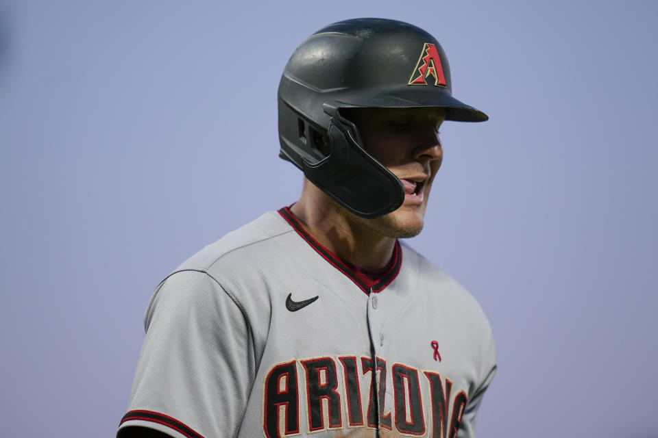 Arizona Diamondbacks' Daulton Varsho walks to the dugout after striking out against the San Francisco Giants during the fifth inning of a baseball game in San Francisco, Tuesday, Aug. 16, 2022. (AP Photo/Godofredo A. Vásquez)