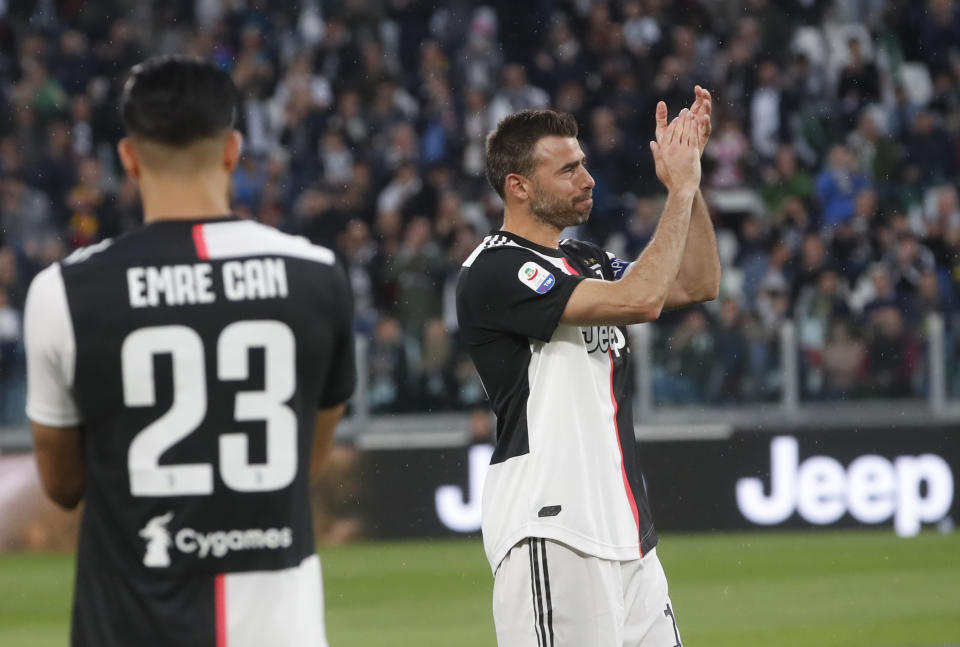 Juventus' Andrea Barzagli, right, prior to the Serie A soccer match between Juventus and Atalanta at the Allianz stadium, in Turin, Italy, Sunday, May 19, 2019. (AP Photo/Antonio Calanni)