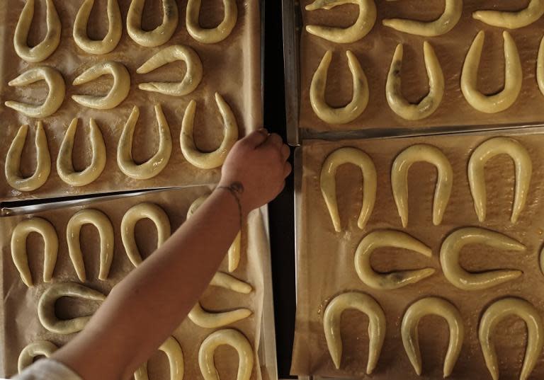 A worker prepares a traditional Slovakian delicacy, a pastry filled with poppy seeds and walnuts that dates from the 16th century, at the Fantastico pastry shop in Bratislava on December 19, 2014