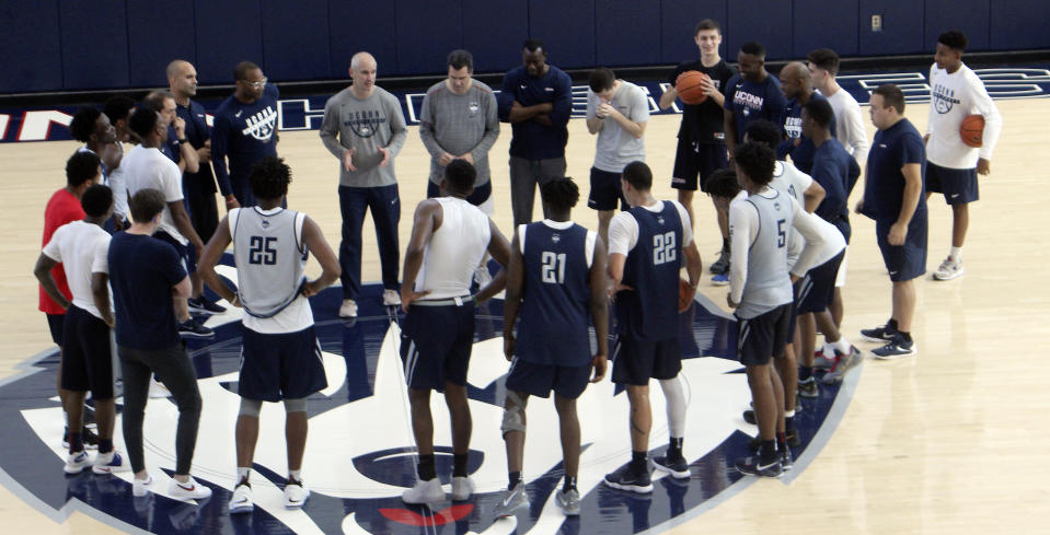 Connecticut coach Dan Hurley addresses his team during their first NCAA college basketball practice on Saturday, Sept. 29, 2018 in Storrs, Conn. The team opened practice a day after the NCAA notified the school of violations during former coach Kevin Ollie's tenure there. (AP Photo/Pat Eaton-Robb)