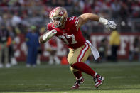 FILE - San Francisco 49ers defensive end Nick Bosa (97) rushes during the team's NFL football game against the Washington Commanders, Dec.24, 2022, in Santa Clara, Calif. Bosa, Chiefs defensive tackle Chris Jones and Dallas Cowboys edge rusher Micah Parsons are the finalists for AP Defensive Player of the Year. (AP Photo/Scot Tucker, File)