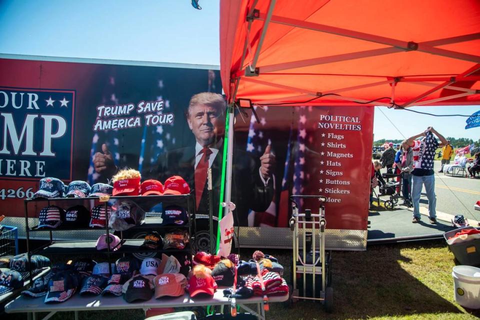 Vendors sell all manner of Trump souvenirs prior to a GOP rally featuring former president Donald Trump, at Wilmington International Airport Friday, Sept. 23, 2022.