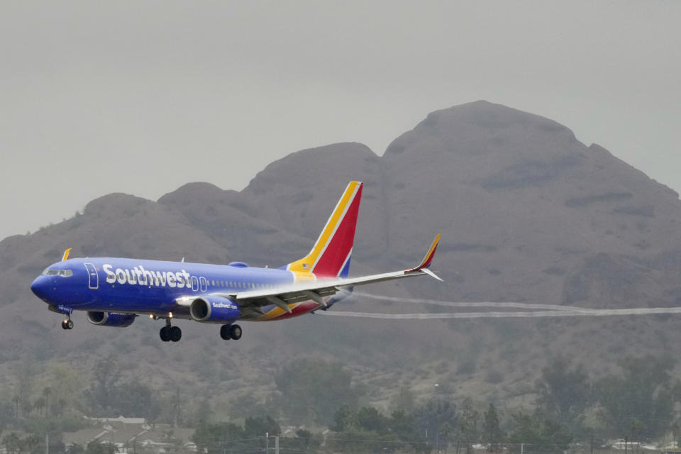 FILE - A Southwest Airlines jet arrives at Sky Harbor International Airport, Dec. 28, 2022, in Phoenix. With its flights now running on a roughly normal schedule, Southwest Airlines is turning its attention to luring back customers and repairing damage to a reputation for service after canceling 15,000 flights around Christmas. The disruptions started with a winter storm and snowballed when Southwest's ancient crew-scheduling technology failed. (AP Photo/Matt York, File)