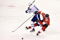 Jan 18, 2019; Sunrise, FL, USA; Toronto Maple Leafs right wing Mitchell Marner (16) collides with Florida Panthers center Henrik Borgstrom (95) during the third period at BB&T Center. Mandatory Credit: Steve Mitchell-USA TODAY Sports