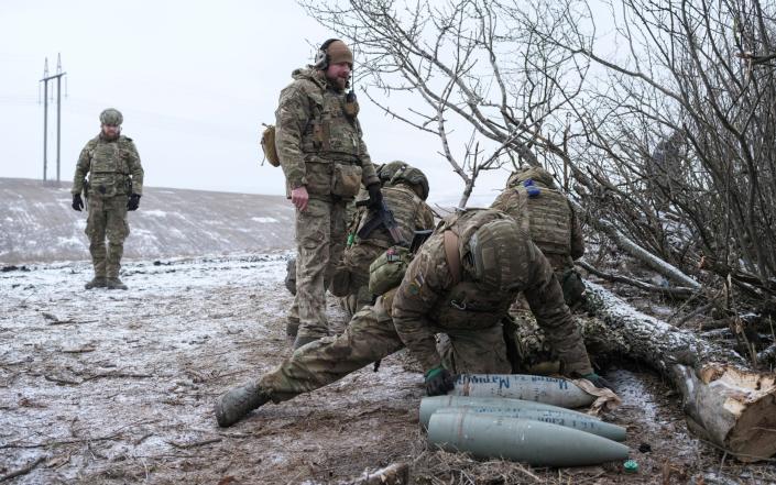 Ukrainian soldiers prepare to fire a 152 mm howitzer 2A65 Msta-B near Bahkmut yesterday - REUTERS/Marko Djurica