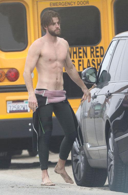 Liam Hemsworth strips off at the beach