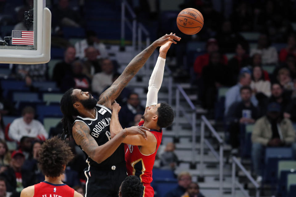 Brooklyn Nets center DeAndre Jordan (6) blocks a shot by New Orleans Pelicans guard Josh Hart in the second half of an NBA basketball game in New Orleans, Tuesday, Dec. 17, 2019. The Nets won in overtime 108-101. (AP Photo/Gerald Herbert)