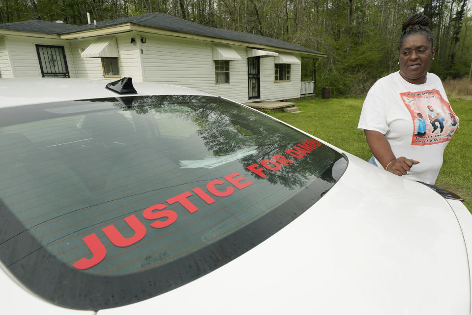 Monica Lee stands outside her eldest son's house in Braxton, Miss., Tuesday, March 21, 2023, as she talks about her youngest son, Damien Cameron. The 29-year-old Black man, with a history of mental illness, died in July 2021 after being arrested by two Rankin County sheriff's deputies. An Associated Press investigation found that deputies from a special unit of that sheriff's department are being investigated by the U.S. Justice Department for their role in another incident where they may have committed civil rights violations. (AP Photo/Rogelio V. Solis)