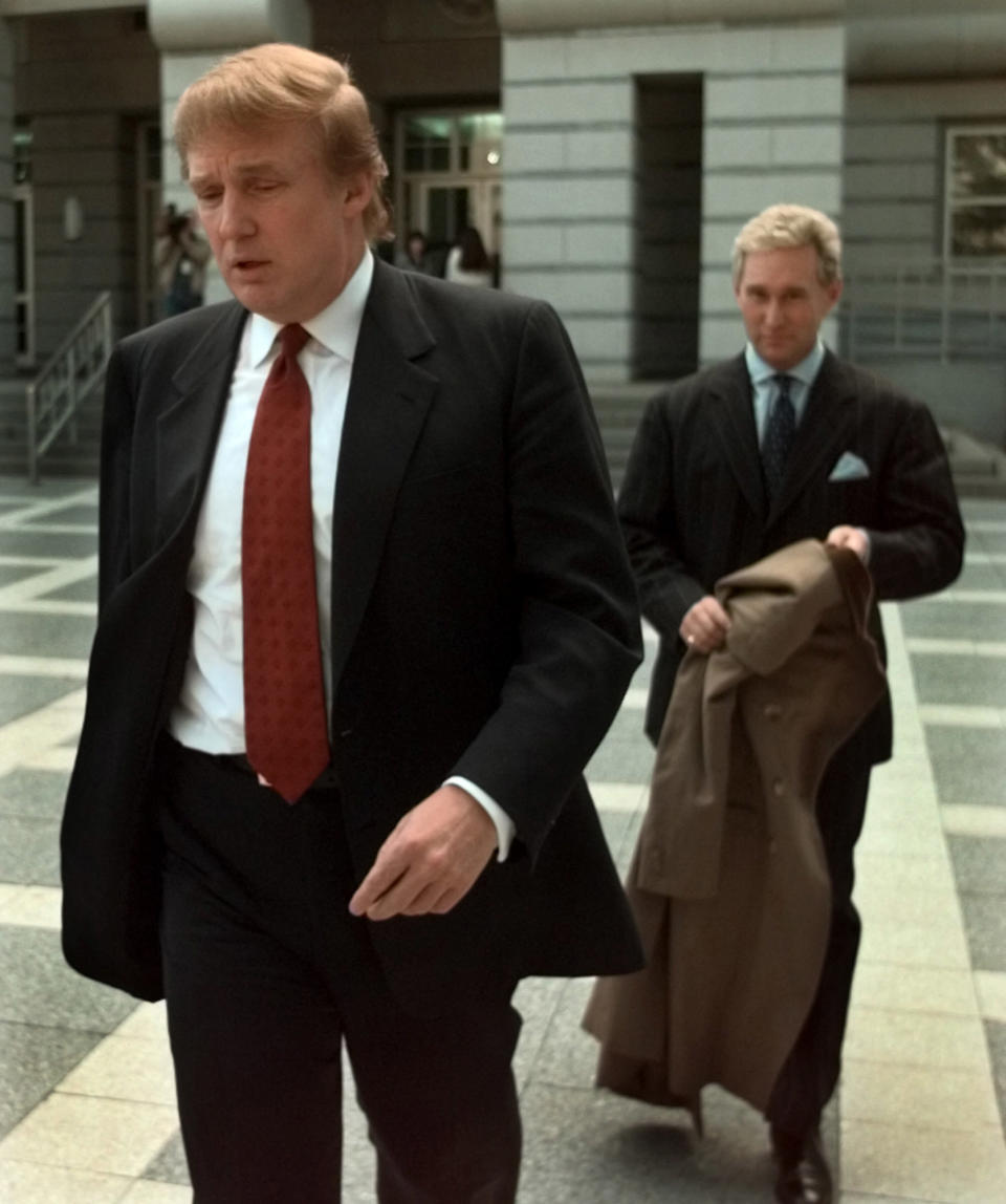 Donald Trump, photographed in Oct. 1999, with Roger Stone, the director of his presidential exploratory committee, walking behind him.