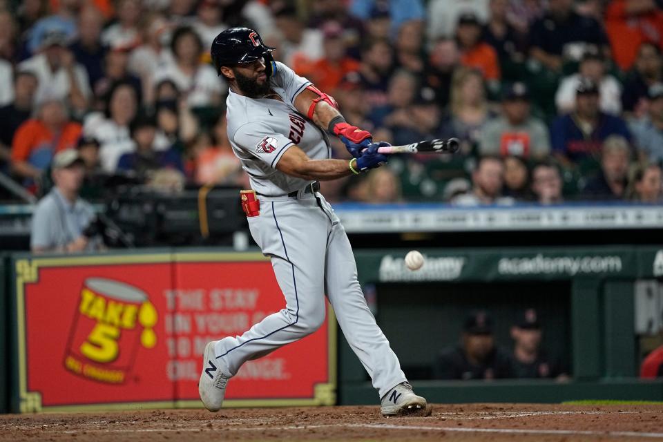 Cleveland Guardians' Amed Rosario hits a ground ball against the Houston Astros during the third inning of a baseball game Monday, May 23, 2022, in Houston. (AP Photo/David J. Phillip)