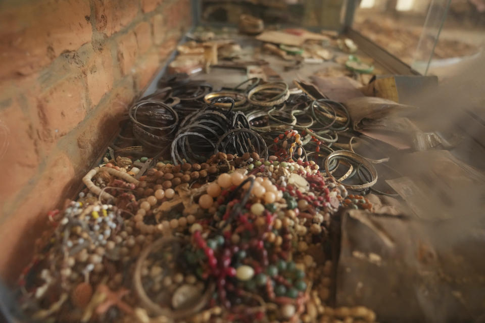 A view of jewelry belonging to victims as they sought refuge placed on the altar, as a memorial to the thousands who were killed during the 1994 genocide in and around the Catholic church, in Nyamata, Rwanda, Friday, April 5, 2024. An estimated 800,000 Tutsis were killed by extremist Hutus in massacres that lasted over 100 days in 1994. Some moderate Hutu who tried to protect members of the Tutsi minority were also targeted. (AP Photo/Brian Inganga)