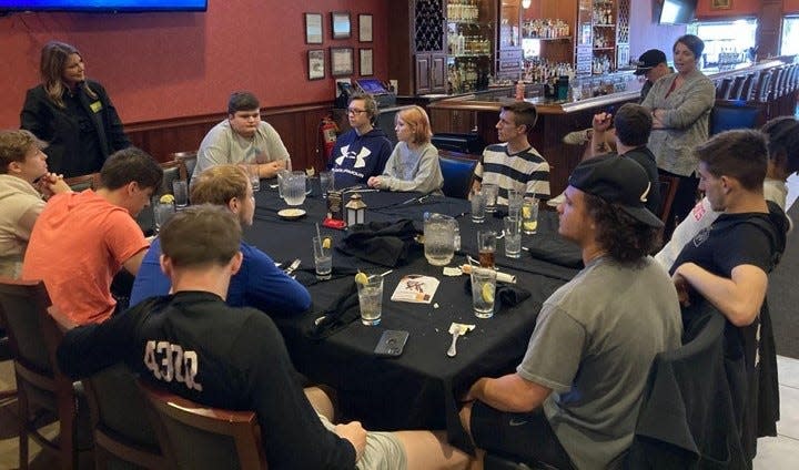 Carly Thompson speaks with students of the Coshocton High School Entrepreneur Club during a May 2023 field trip that included Thompsons Ninety-Nine restaurant. Thompson said the club is a great way for students to see that owning your own business and improving your community is something anyone can do.