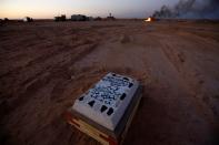 Members of the Popular Mobilization Forces (PMF) bury people who passed away due to coronavirus disease (COVID-19) at the new Wadi Al-Salam cemetery on the outskirts of the holy city of Najaf