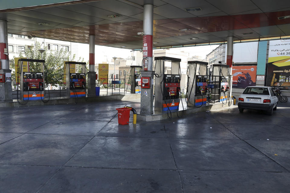 A gas station is empty because the pumps are out of service, in Tehran, Iran, Tuesday, Oct. 26, 2021. Gas stations across Iran on Tuesday suffered through a widespread outage of a system that allows consumers to buy fuel with a government-issued card, stopping sales. One semiofficial news agency referred to the incident as a cyberattack. (AP Photo/Vahid Salemi)