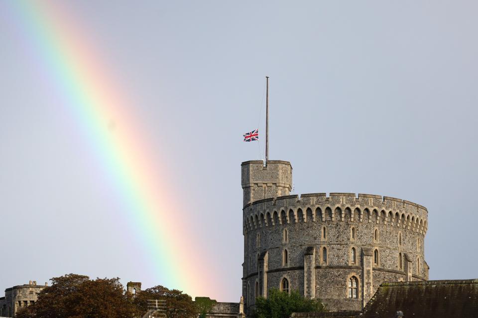 The Union flag is lowered on Windsor Castle as a rainbow covers the sky on Sept. 8, 2022 in Windsor, England.   Queen Elizabeth II died at Balmoral Castle in Scotland on Sept. 8, 2022, and is survived by her four children, Charles, Prince of Wales, Anne, Princess Royal, Andrew, Duke Of York and Edward, Duke of Wessex.