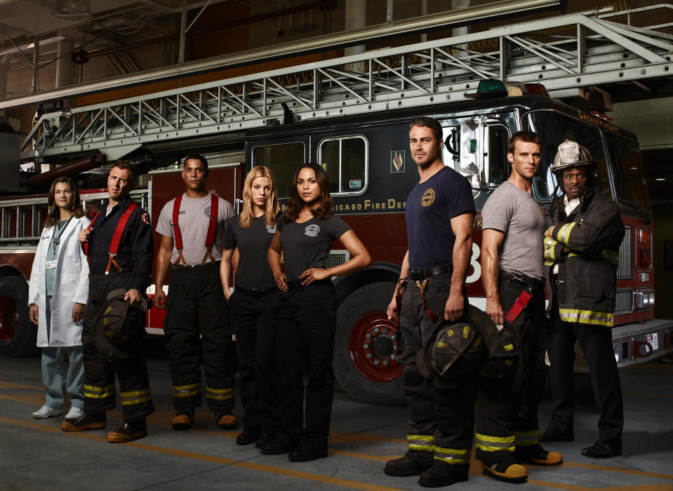 This image released by NBC shows the cast of "Chicago Fire," from left, Teri Reeves as Hallie, David Eigenberg as Christopher Hermann, Charlie Barnett as Peter Mills, Lauren German as Leslie Shay, Monica Raymund as Gabriella Dawson, Taylor Kinney as Kelly Severide, Jesse Spencer as Matthew Casey and Eamonn Walker as Battalion Chief Walter Boden. The series premieres Oct. 10 at 10 p.m. EST on NBC. (AP Photo/NBC)