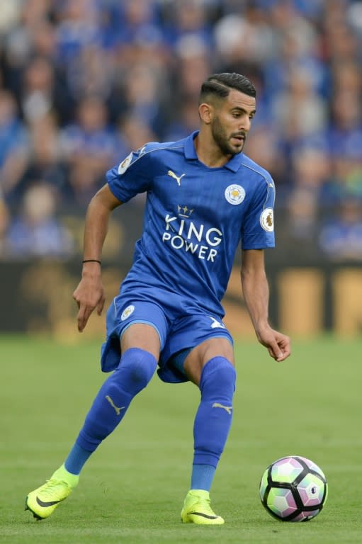 Leicester City's midfielder Riyad Mahrez runs with the ball on August 20, 2016