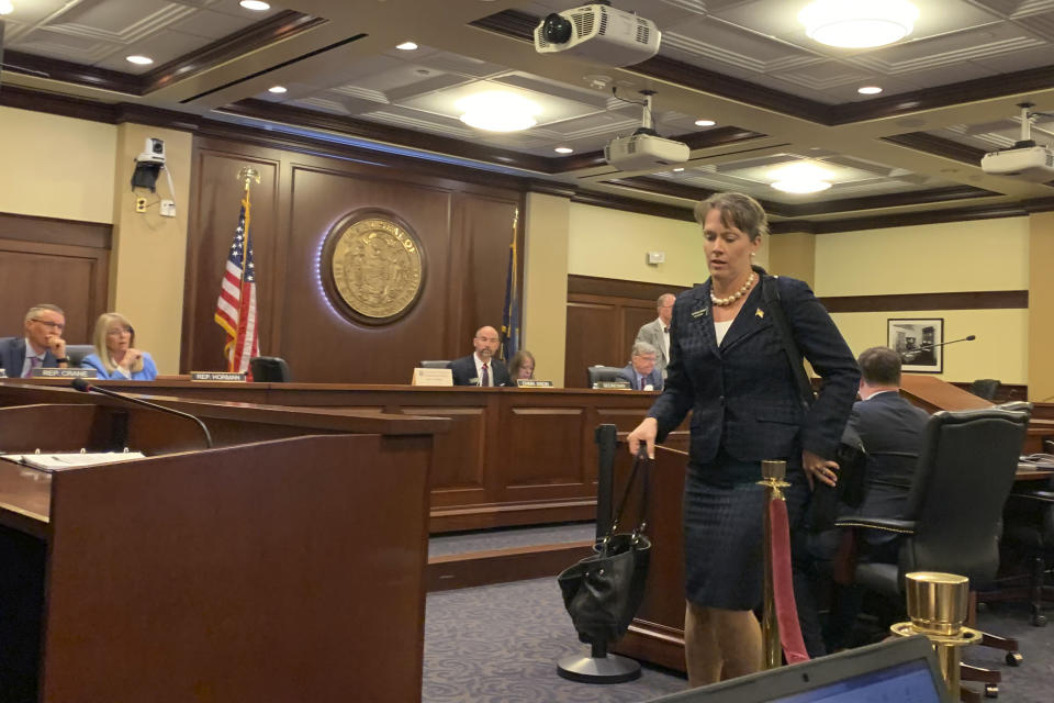 Rep. Priscilla Giddings makes her way into a committee hearing to determine if she violated the Idaho Legislature's ethics rules in Boise, Idaho., on Monday, Aug. 2, 2021. An Idaho lawmaker accused of violating ethics rules by publicizing the name of an alleged rape victim in disparaging social media posts and then allegedly misleading lawmakers about her actions, said in an ethics hearing Monday that she did nothing wrong and claimed the allegations against her were politically motivated. (AP Photo/Rebecca Boone)