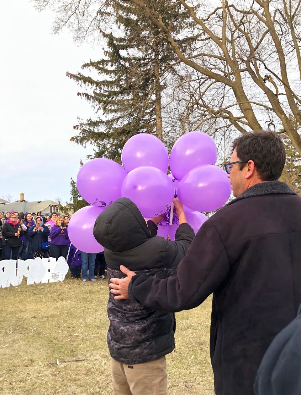 Family members release balloons at a memorial for Oliver Hitchcock on Sunday, April 11, 2022 in Sheboygan Falls.