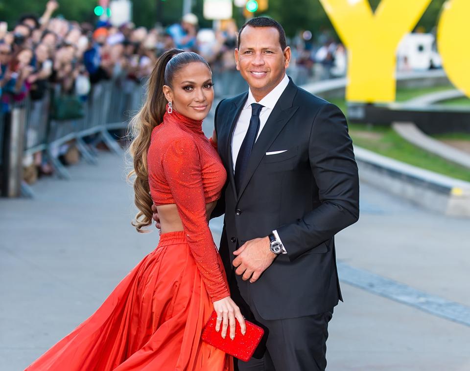 Jennifer Lopez and Alex Rodriguez pose at an event