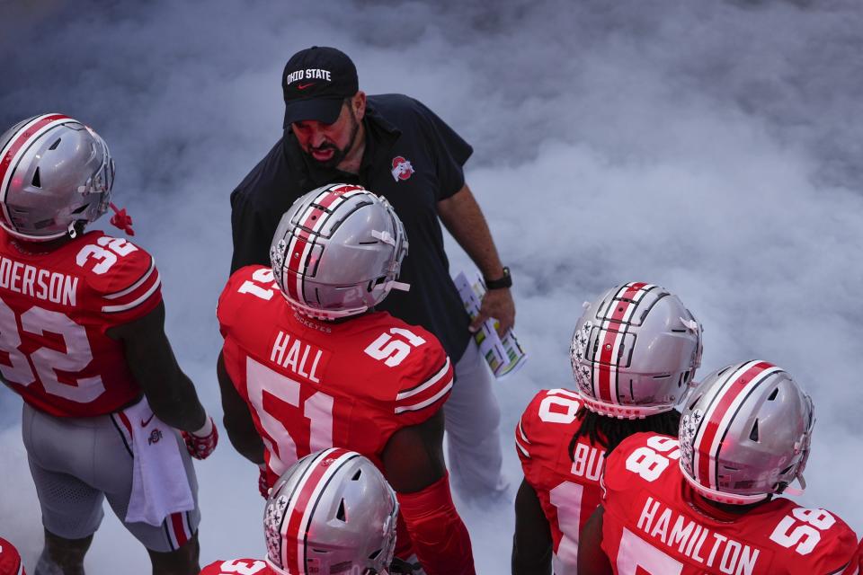 Sep 16, 2023; Columbus, Ohio, USA; Ohio State Buckeyes head coach Ryan Day leads his team onto the field for the NCAA football game against the Western Kentucky Hilltoppers at Ohio Stadium.