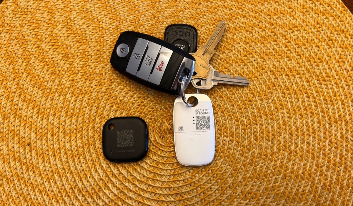 The Eufy and Tile trackers have scannable QR codes on the back, which could help someone return your lost item. Unfortunately, the Eufy's print is tiny and hard to read, and both codes are too small to scan easily. (Photo: Rick Broida/Yahoo)