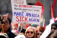 Activists protest against the Republican plan to repeal Obamacare during a rally in Freedom Plaza in Washington March 23, 2017. REUTERS/Kevin Lamarque