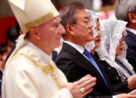 South Korean President Moon Jae-in looks on as Italian cardinal Pietro Parolin arrives to lead a special mass for peace in the Korean peninsula in Saint Peter's Basilica at the Vatican, October 17, 2018. REUTERS/Max Rossi