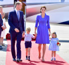The family of four held hands as they arrived at Berlin Tegel Airport in Germany for an official visit.