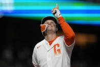 San Francisco Giants' Joc Pederson points to sky as he crosses home plate after hitting a two-run home run against the New York Mets during the fifth inning of a baseball game in San Francisco, Tuesday, May 24, 2022. (AP Photo/Tony Avelar)