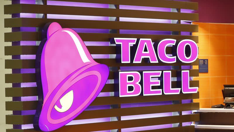 The Taco Bell logo is seen, April 19, 2019, at a restaurant in Miami. A man is suing Taco Bell for false advertising, alleging that the fast food chain skimps on its beef fillings for some of its products.