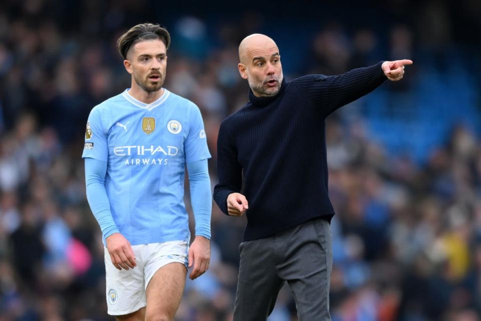 Guardiola approaches Grealish after City's 0-0 draw with Arsenal (Getty)