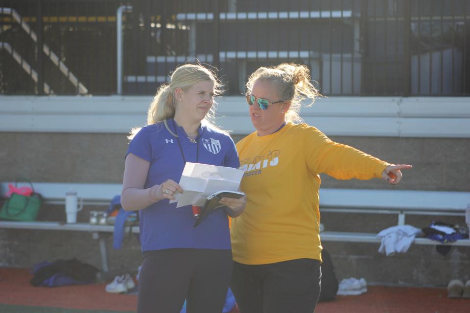 St. Vincent's soccer coaches Sarah Stewart and Ciara Thomas talk things over during a workout on Jan. 30, 2024.