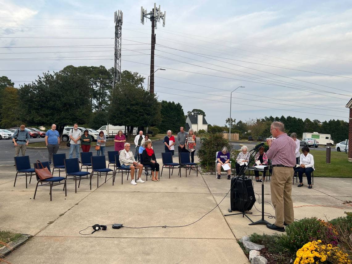 Members of First Alliance Church on Buffaloe Road in Raleigh gathered for a vigil Oct. 16, 2022, to pray for the victims killed and injured in the mass shooting in the Hedingham neighborhood nearby.