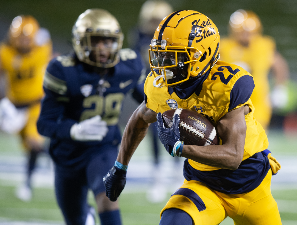 Kent State's Chrishon McCray runs to the end zone for a touchdown against the University of Akron on Wednesday night in Akron.