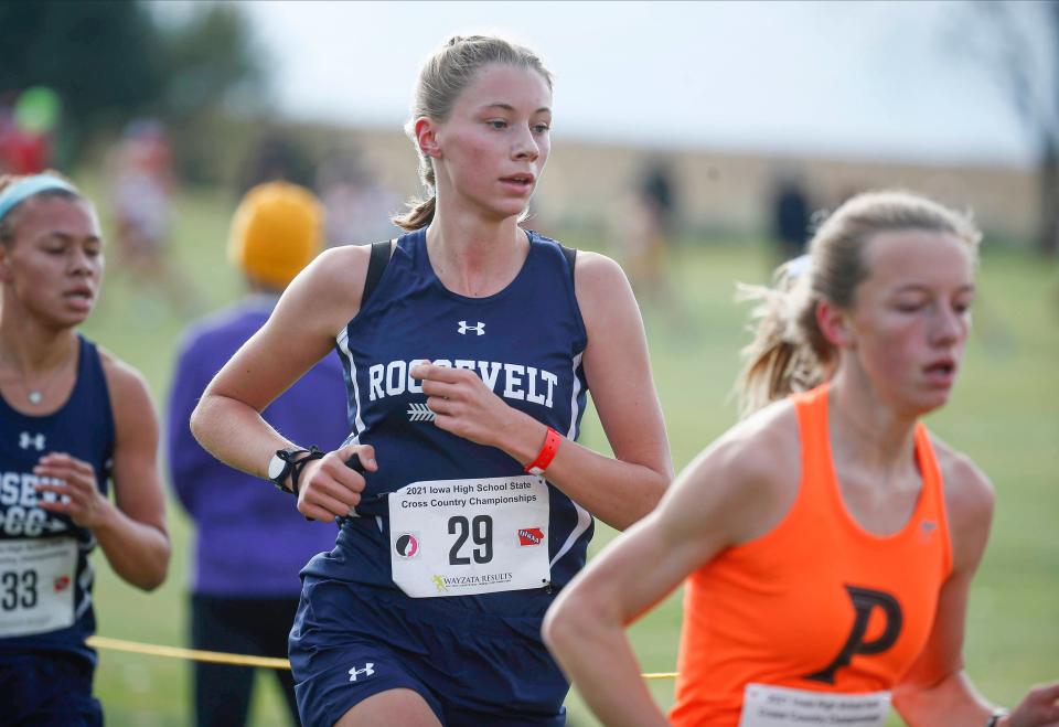 Des Moines Roosevelt junior Adrienne Buettner-Cable makes her way around the course during the Class 4A Iowa high school state cross country meet on Friday, Oct. 29, 2021, in Fort Dodge.