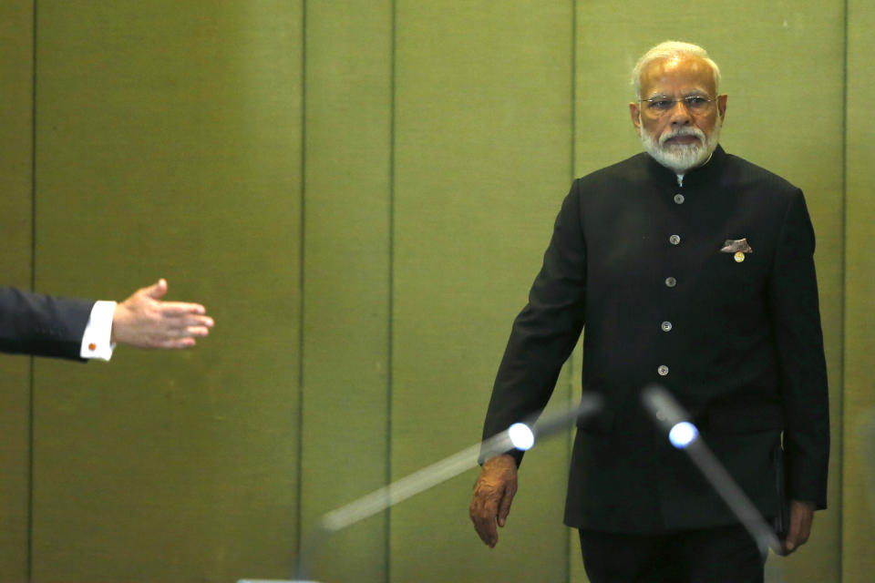 India's Prime Minister Narendra Modi arrives to attend the Leaders Dialogue with BRICS Business Council and the New Development Bank, at the Itamaraty Palace in Brasilia, Brazil, Thursday, Nov. 14, 2019. (AP Photo /Eraldo Peres)