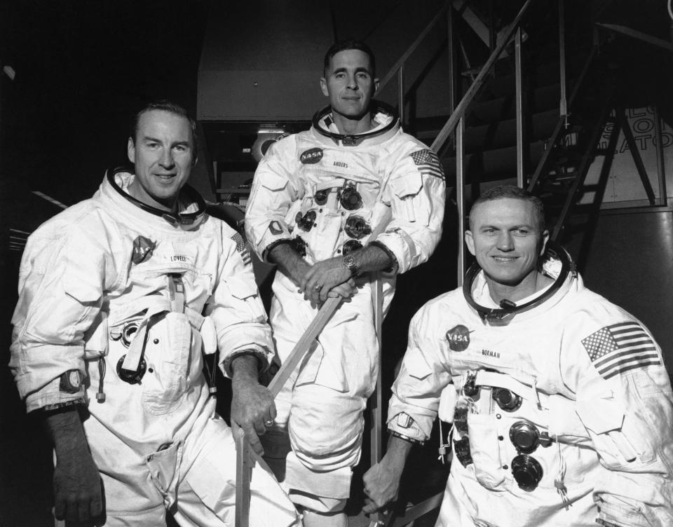 FILE - Apollo 8 astronauts, from left, James Lovell, command module pilot; William Anders, lunar module pilot; and Frank Borman, commander; stand in front of mission simulator prior to training in exercise for their scheduled six-day lunar orbital mission at the Kennedy Space Center in Florida, Dec. 18, 1968. Borman, who commanded Apollo 8's historic Christmas 1968 flight that circled the moon 10 times and paved the way for the lunar landing seven months later, has died. He was 95. Borman died Tuesday, Nov. 7, 2023, in Billings, Mont., according to a NASA statement Thursday, Nov. 9. (AP Photo/File)