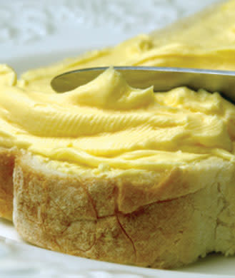 <div class="caption-credit"> Photo by: Thinkstock</div><div class="caption-title">Margarine</div>Poor margarine. The scientists who invented it way back when had the best intentions. They knew that butter contained high amounts of unhealthy saturated fats and that vegetable oil did not-so after some lab tinkering, they transformed this healthier oil into a solid, spreadable form, which was then marketed for years as a heart-smart alternative to butter. Unfortunately the process of transforming a liquid to a solid requires hydrogenation, which creates wildly unhealthy (and now nearly banned) trans fats. <br> <br> <b>More on <a rel="nofollow noopener" href="http://www.shape.com" target="_blank" data-ylk="slk:SHAPE:;elm:context_link;itc:0;sec:content-canvas" class="link ">SHAPE:</a> <br> <a rel="nofollow noopener" href="http://www.shape.com/healthy-eating/diet-tips/15-bad-excuses-women-make-not-eating-healthy" target="_blank" data-ylk="slk:15 Bad Excuses for Not Eating Healthy;elm:context_link;itc:0;sec:content-canvas" class="link ">15 Bad Excuses for Not Eating Healthy</a> <br> </b>